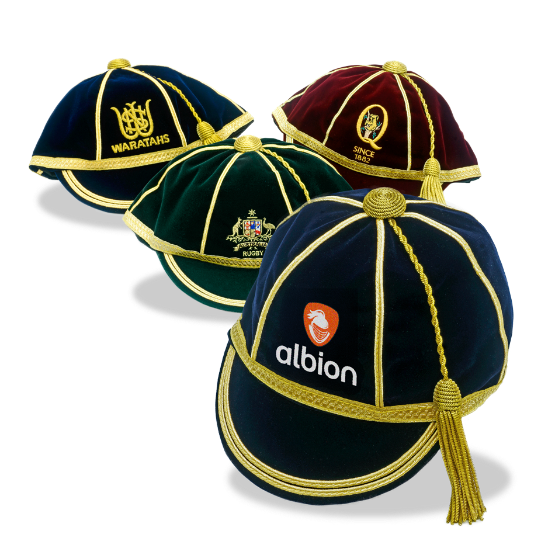 Four velvet honours caps with gold trim and tassels, featuring Albion, Waratahs, Queensland Rugby and Rugby Australia embroidered logos.