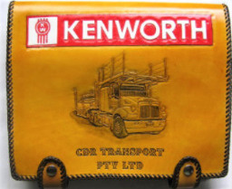 Leather NHVR log book cover with Kenworth logo, truck carving, company name, handmade in Australia.